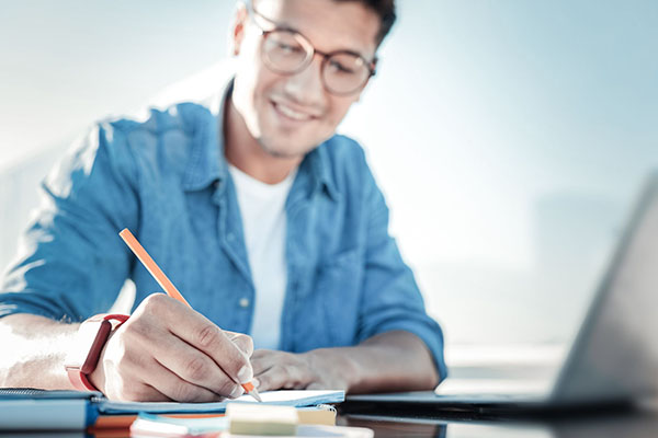 Diligent student preparing home assignment outdoors